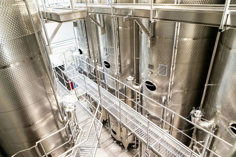 Stainless steel processing tanks in a food production facility